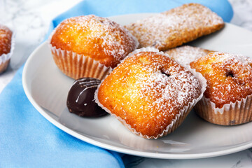 Mini muffins on white plate. Selective focus.