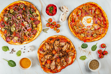 Delicious Traditional Italian pizza on a bright background, top view on pizza in pizza shop.