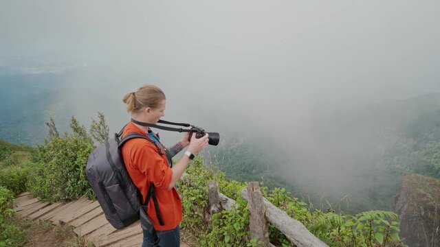 Man photographer making photo at Kew mae pan nature trail at Doi Inthanon national park ,Chiangmai