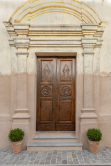 Fototapeta na wymiar portone d'ingresso dell'oratorio San Giuseppe di Isola Dovarese