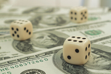 Dice on dollar bills. Winning casino roll. Three sixes on dice.