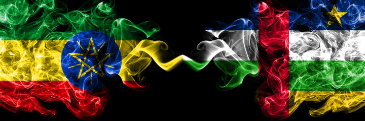 Ethiopia, Ethiopian vs Central African Republic smoky mystic flags placed side by side. Thick colored silky abstract smoke flags.