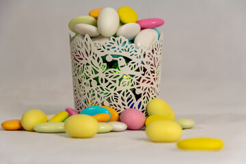 Easter colorfull almonds cup and pile