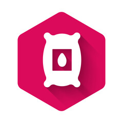 White Pack full of seeds of a specific plant icon isolated with long shadow background. Pink hexagon button. Vector