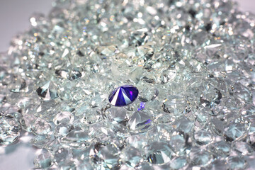 Blue diamonds are placed on a pile of white diamonds And keep turning. video 4k resolution shoot in...