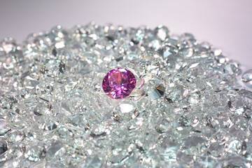 Pink diamonds are placed on a pile of white diamonds And keep turning. video 4k resolution shoot in studio.
