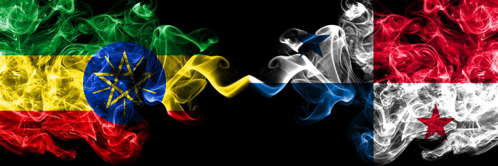 Ethiopia, Ethiopian vs Panama, Panamanian smoky mystic flags placed side by side. Thick colored silky abstract smoke flags.