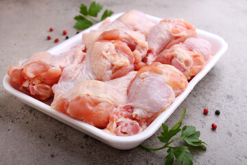 Raw meat. Chicken wings on concrete background.