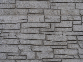 Grey beige concrete block tile wall structure background