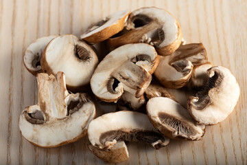 Slices of brown mushrooms on the table
