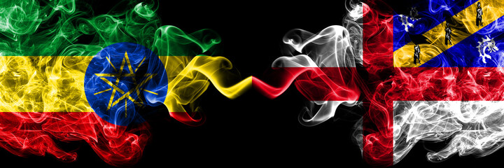 Ethiopia, Ethiopian vs United Kingdom, Great Britain, British, Herm  smoky mystic flags placed side by side. Thick colored silky abstract smoke flags.