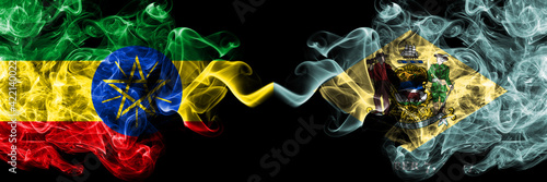 Ethiopia, Ethiopian vs United States of America, America, US, USA, American, Delaware smoky mystic flags placed side by side. Thick colored silky abstract smoke flags.