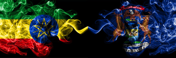Ethiopia, Ethiopian vs United States of America, America, US, USA, American, Michigan smoky mystic flags placed side by side. Thick colored silky abstract smoke flags.
