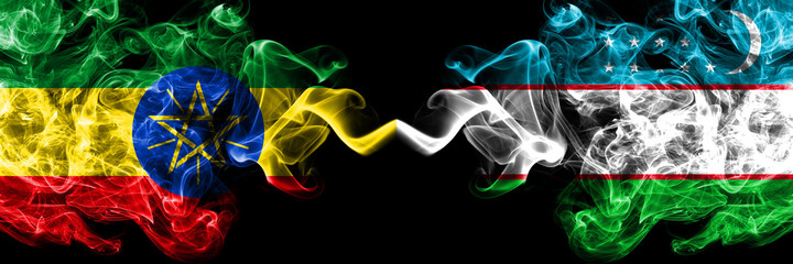 Ethiopia, Ethiopian vs Uzbekistan smoky mystic flags placed side by side. Thick colored silky abstract smoke flags.