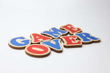 Text "game over" from wooden color letters on a white background.