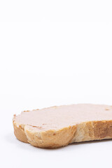 Sliced of bread with pate isolated above white background