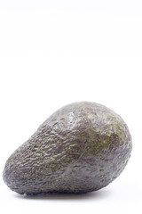 Whole Avocado above white background with copy space