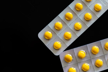 Yellow tablets in bubble pack