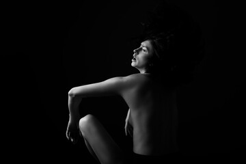 Sexy photo. woman profile silhouette in dark. Sensual. Dark background. 
