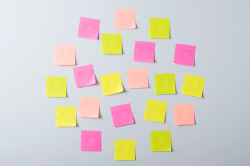 Circle of empty sticky notes on the wall. Write down short phrases to memorize the information.