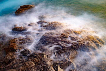 Waves crashing on rocks