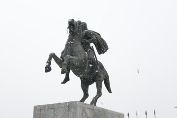 Statue of Alexander the Great monument in Thessaloniki, Greece, on a snowy day