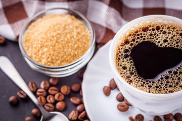 cup of fragrant fresh coffee on a dark stone background