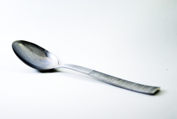 Silver spoon on a white background