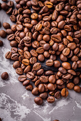 aromatic fresh coffee beans on a dark stone background