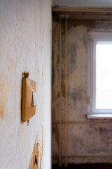 Switch on the wall in an old run-down flat
