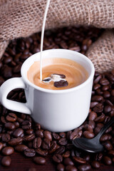 cup of coffee with beans milk
