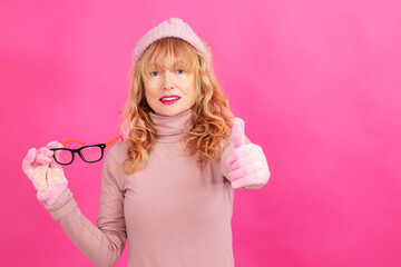 adult woman with glasses and warm clothes isolated on background