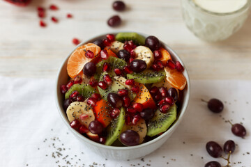 Fruit vitamin salad on a light background