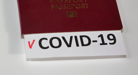 passport with page COVID-19 check list on a white background