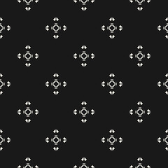 Vector monochrome minimal seamless pattern with small diamond shapes, rhombuses, arrows. Abstract black and white geometric texture. Simple minimalist background. Tribal ethnic motifs. Dark design