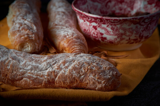 Fartons, typical pastries from Valencia, Spain, with hot chocolate. A sweet breakfast or snack.