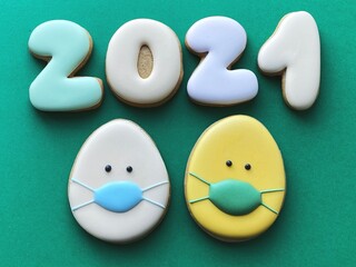 Easter coronavirus concept background. Cute Easter 2021 flatlay. Easter face protective mask 