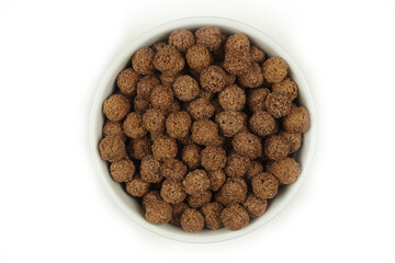 Breakfast cereal. Chocolate balls. Top view.Isolated