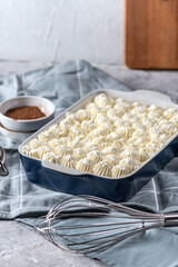 Homemade Tiramisu cake on light background