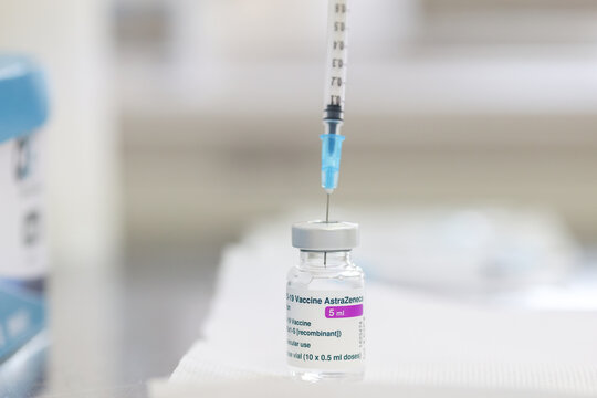 TIMISOARA, ROMANIA - MARCH 21, 2021: Details of AstraZeneca vial with a siringe, prepared for vaccine, at a local health point