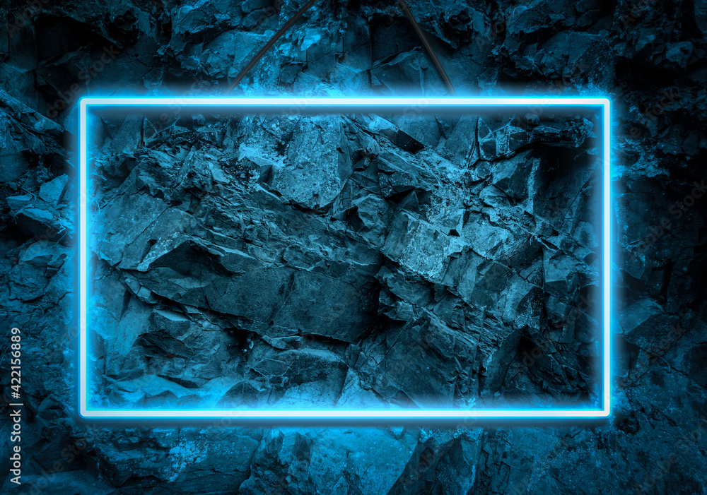 Poster blue neon glowing frame on a background of a layer of stones