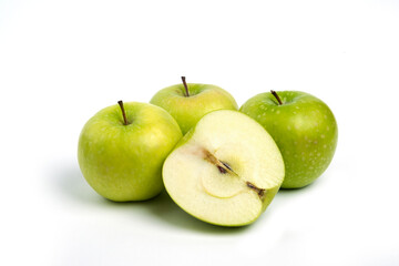 Three fresh whole and sliced apples on wooden piece
