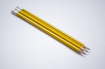 yellow pencil on white background