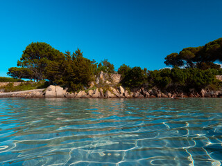 Fototapeta na wymiar Lu Impostu Beach on Sardinia Island. beach of sardinia. clear water of the Sardinian sea