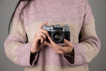 woman holding vintage camera