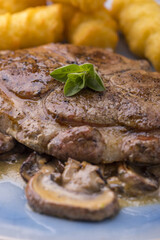 pork steak on mushroom sauce