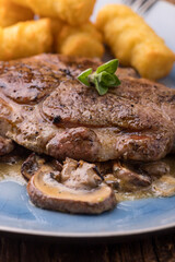 pork steak on mushroom sauce