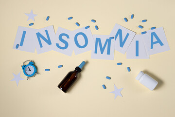 the concept of self-care, good sleep, sleeplessness in yellow tones. pills for insomnia. inscription insomnia