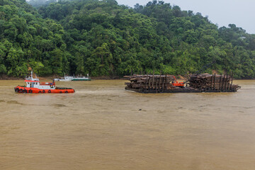 Boat carrying wood at Batang Rejang river in Kapit, Sarawak, Malaysia