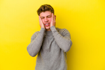 Young caucasian man isolated on yellow background whining and crying disconsolately.